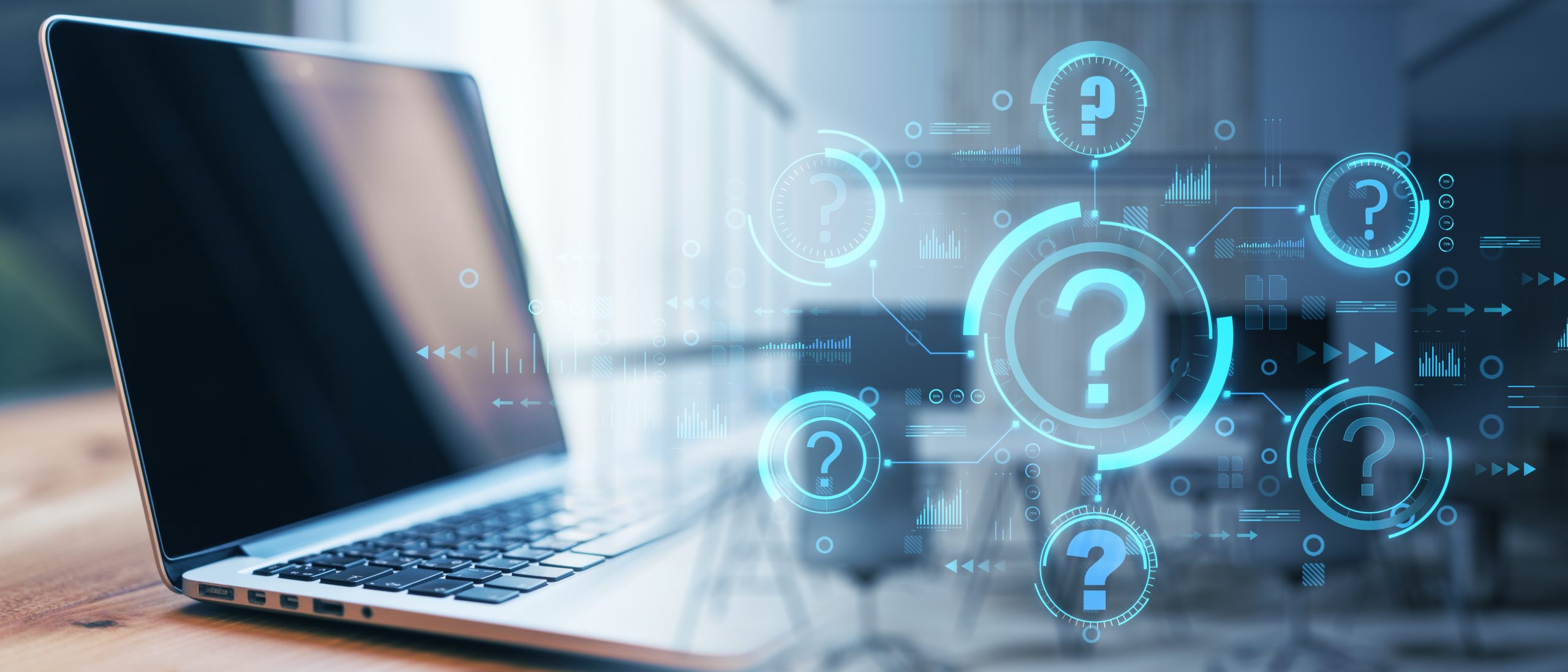 Laptop on a desk with blue holographic question marks and tech UI graphics surrounding it, conveying digital inquiry