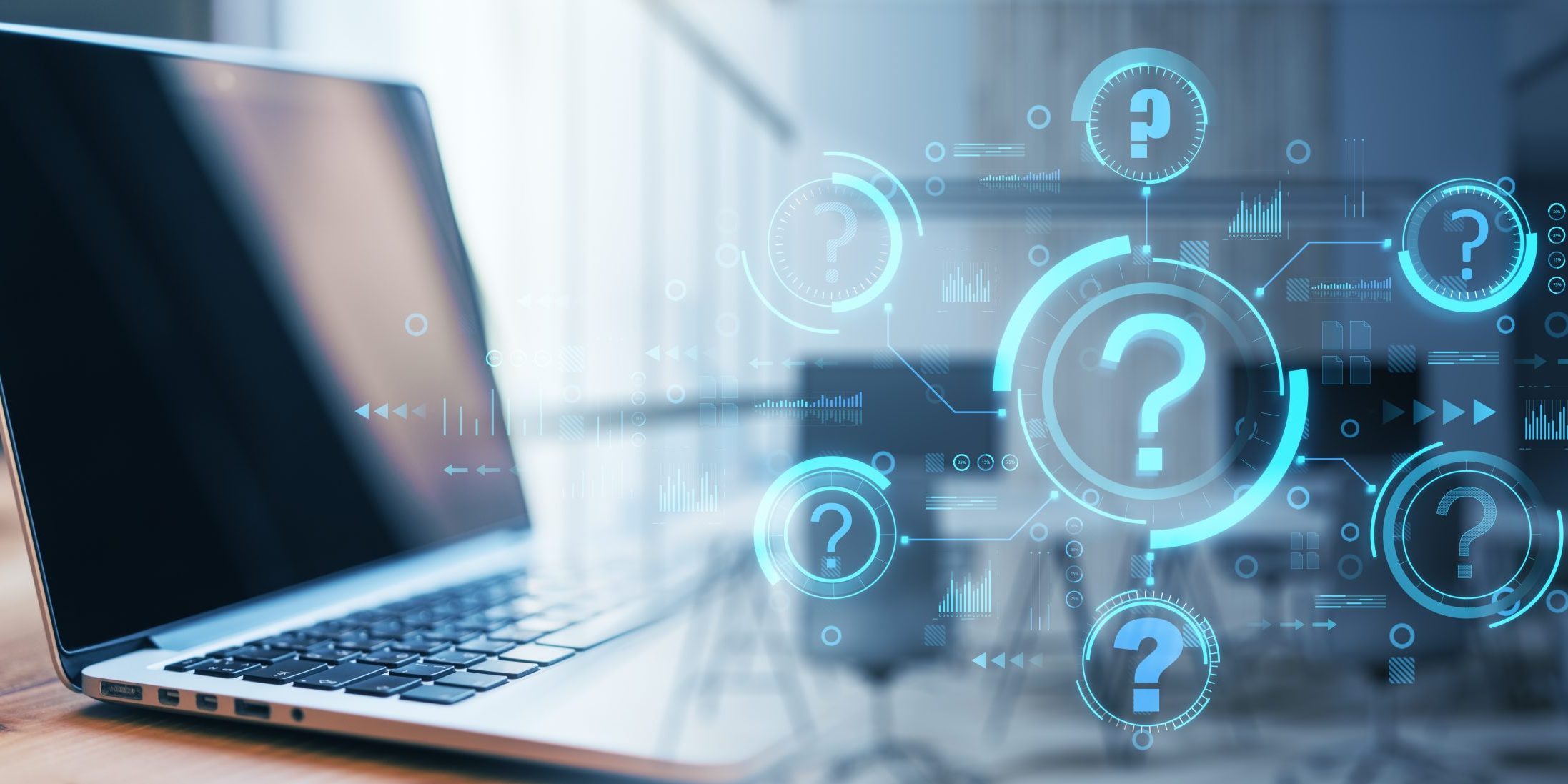 Laptop on a desk with blue holographic question marks and tech UI graphics surrounding it, conveying digital inquiry